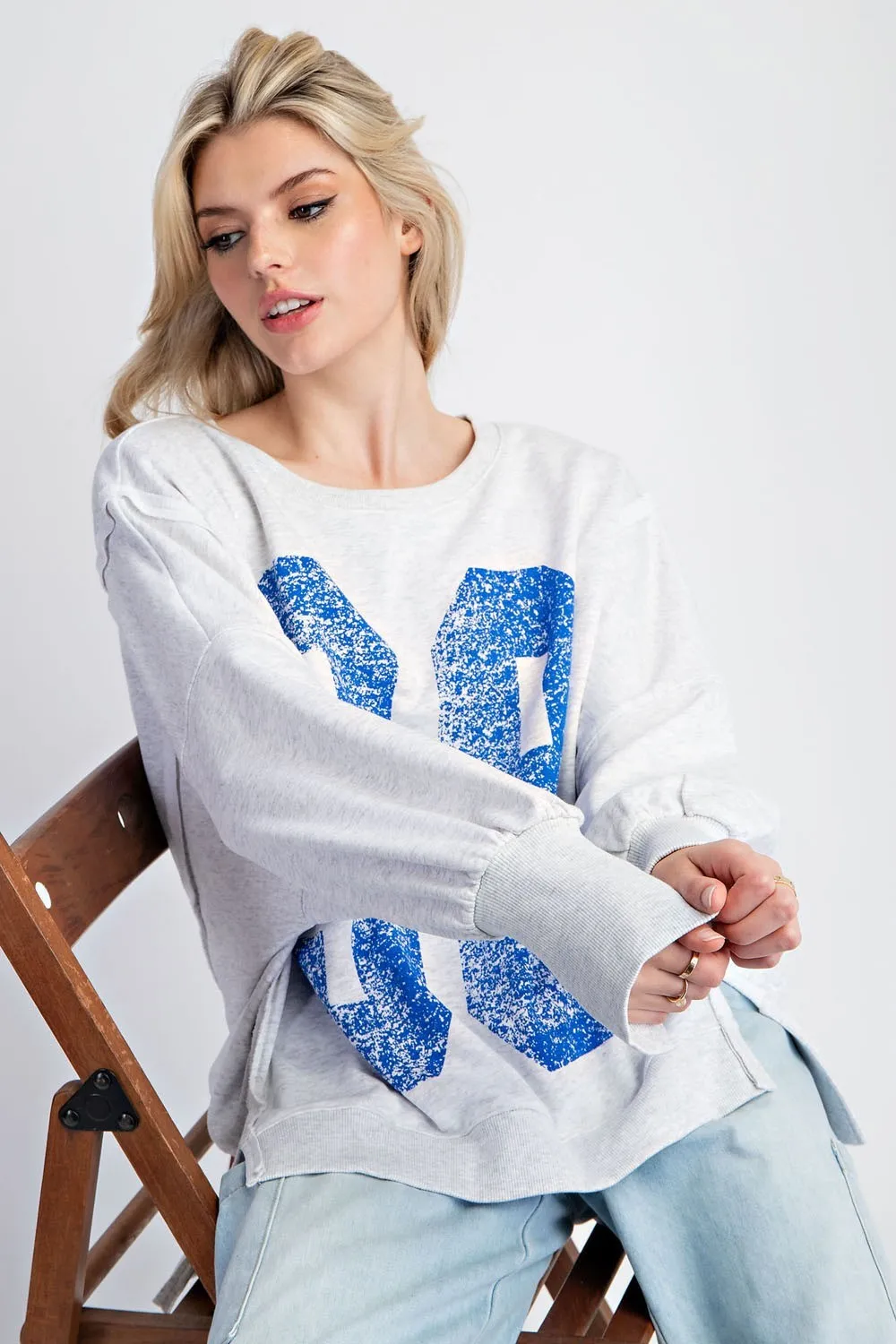 Faded varsity print long sleeve pullover top