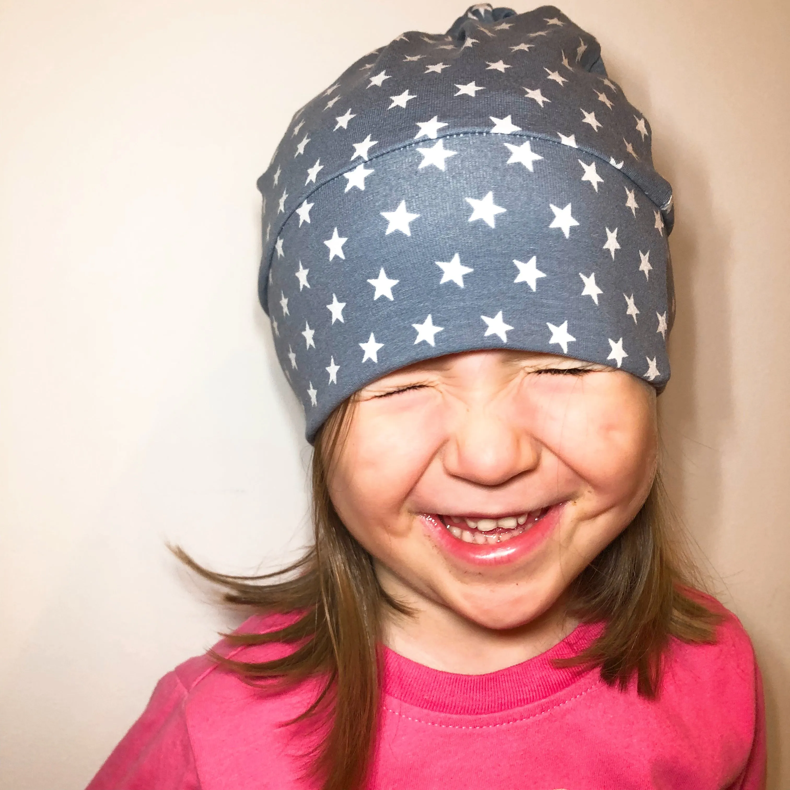 Knot Hat in Newborn: Stripes with Ladybug Rim